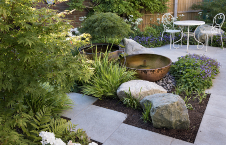 Copper water feature and lush planting