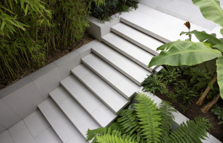 City Courtyard garden with porcelain floating steps between lush subtropical planting.